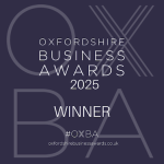 Badge announcing the Oxfordshire Business Awards 2025 winner, featuring the hashtag #OXBA.