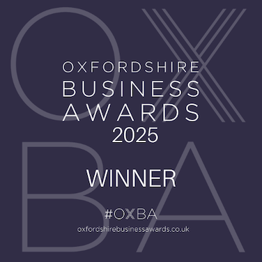 Badge announcing the Oxfordshire Business Awards 2025 winner, featuring the hashtag #OXBA.
